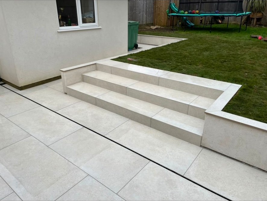 Contemporary light cream porcelain paving slabs and matching outdoor garden steps